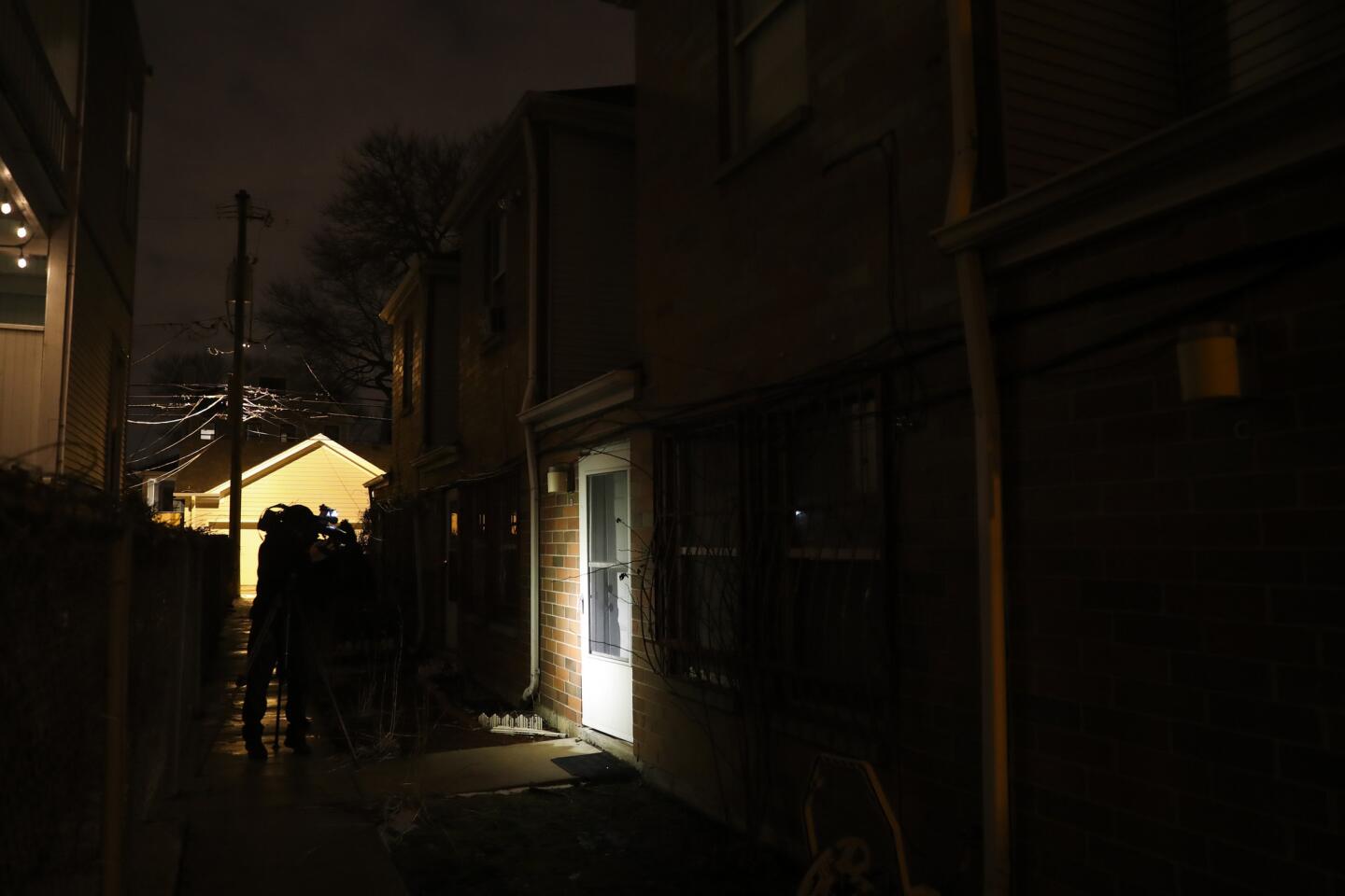 A light shines on the door of a residence that was served with a search warrant in the investigation of the attack on actor Jussie Smollett in the Streeterville neighborhood, Feb. 14, 2019, in Chicago.