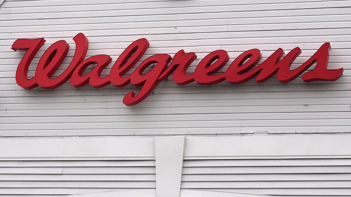FILE - The Walgreens logo on the front of a store, July 14, 2021, in Cambridge, Mass. Walgreens Boots Alliance topped earnings forecasts in the final quarter of fiscal 2022, Thursday, Oct. 13, 2022, and the drugstore chain’s early look at 2023 also fell mostly above expectations. (AP Photo/Charles Krupa)