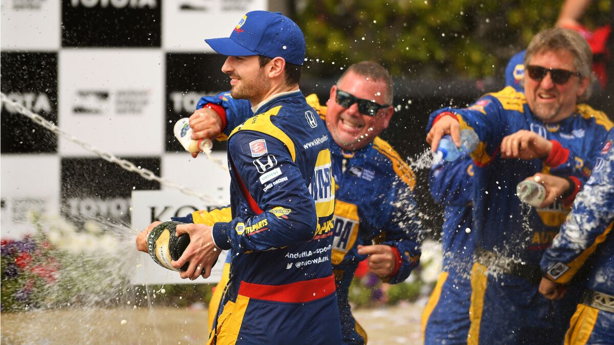 Alexander Rossi, left, celebrates with his team after winning the 2018 Grand Prix of Long Beach.