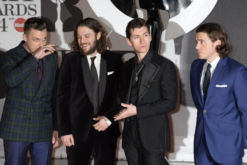Arctic Monkeys arrives Wednesday at the Brit Awards in London, where it won prizes for album and British group of the year.