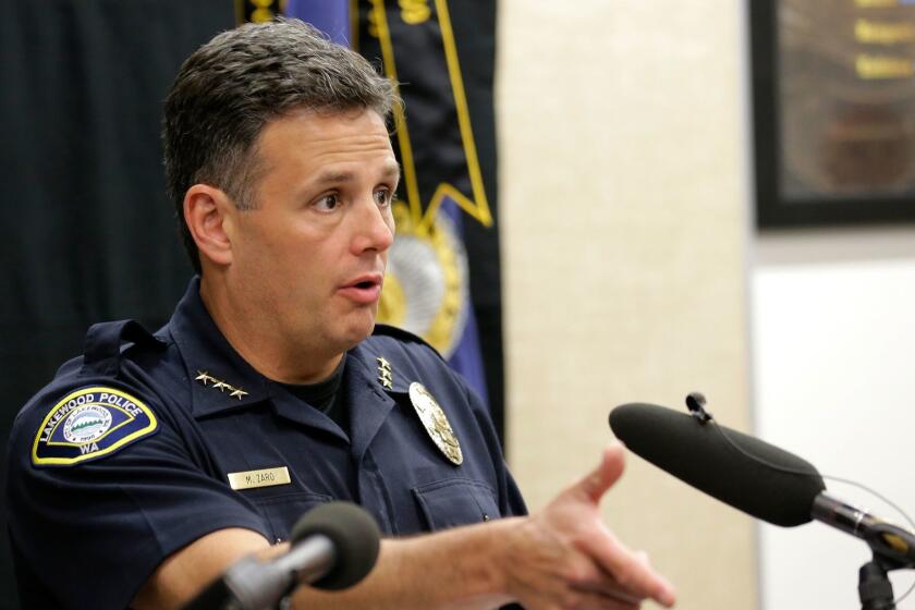 Interim Lakewood Police Chief Mike Zaro talks to reporters Monday, May 11, 2015, at police headquarters in Lakewood, Wash. Zaro says officers shot and killed Daniel Covarrubias in a lumber yard last month because he pointed a cell phone at them as though it were a gun. (AP Photo/Ted S. Warren)