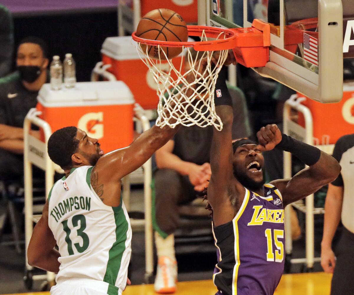 Lakers center Montrezl Harrell scores on a layup against Celtics center Tristan Thompson in the first quarter.