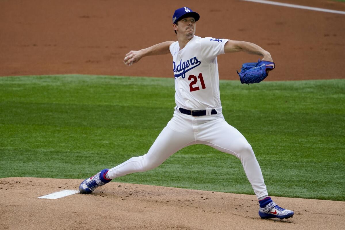 Los Angeles Dodgers starting pitcher Walker Buehler throws against the Atlanta Braves.