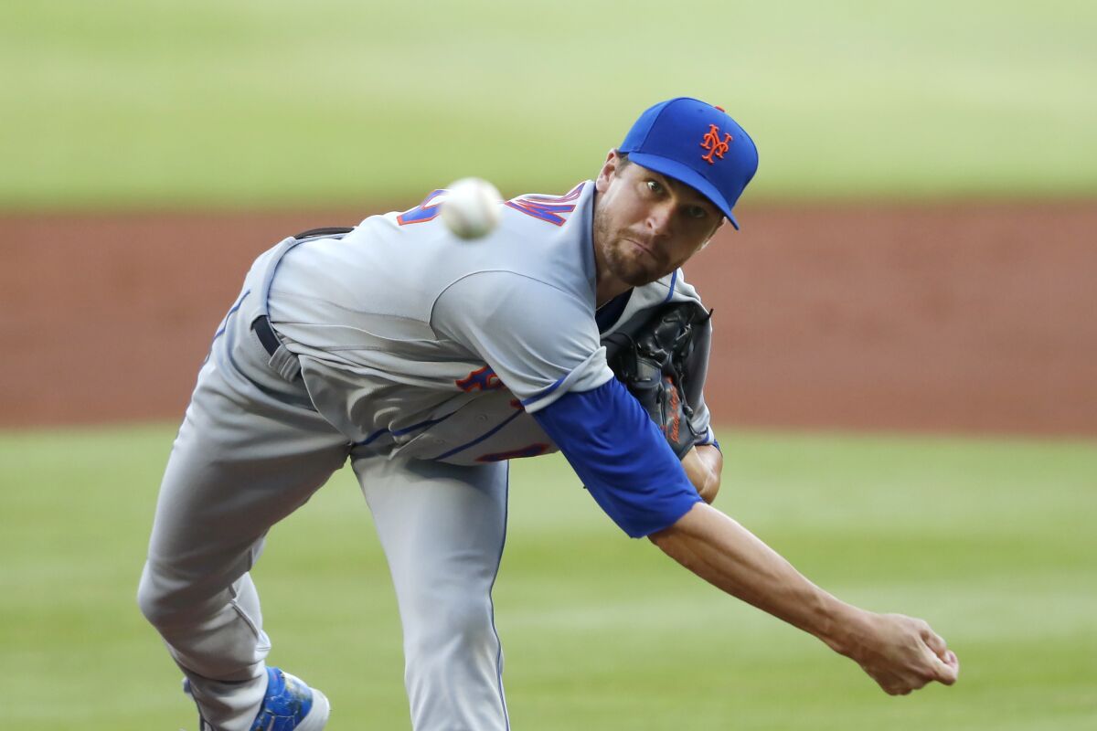 New York Mets starting pitcher Jacob deGrom works during the first inning of the team's baseball game against the Atlanta Braves on Monday, Aug. 3, 2020, in Atlanta. (AP Photo/John Bazemore)