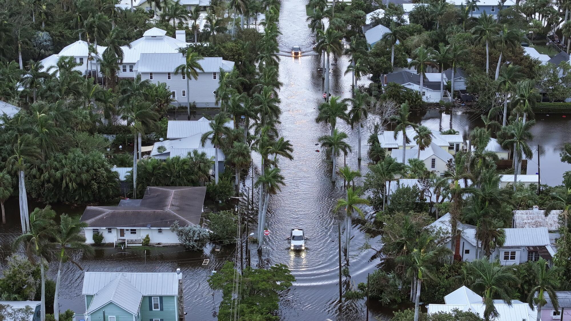 Floodwaters inundate a neighborhood after Hurricane Milton came ashore in Punta Gorda, Fla.