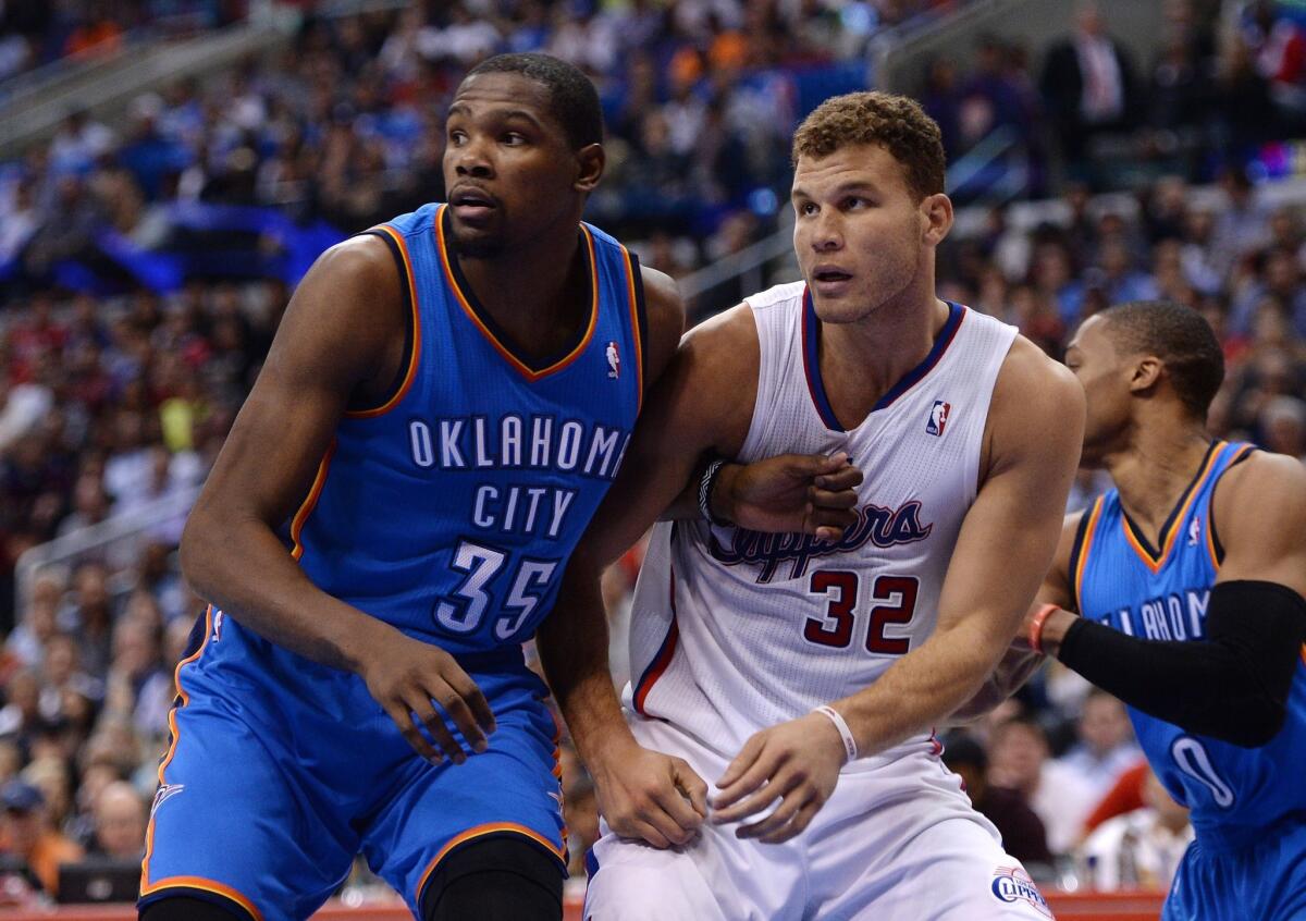 Clippers' Blake Griffin, right, takes on Oklahoma City's Kevin Durant at Staples Center.