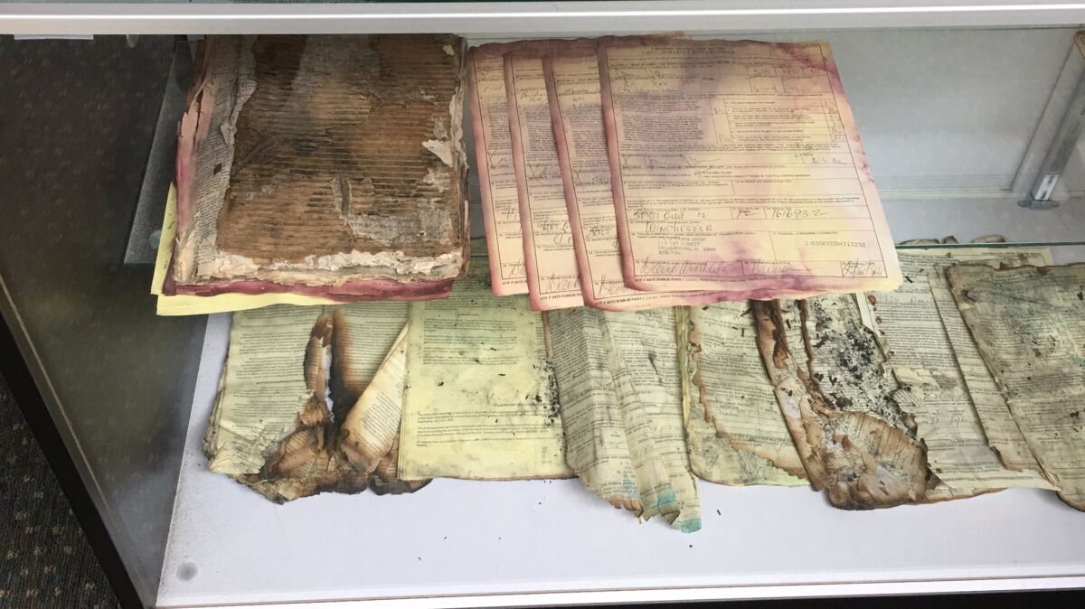Some records arrive at the ATF's tracing center in pretty bad shape. These are displayed in the bureau's "hall of shame." (Del Quentin Wilber)