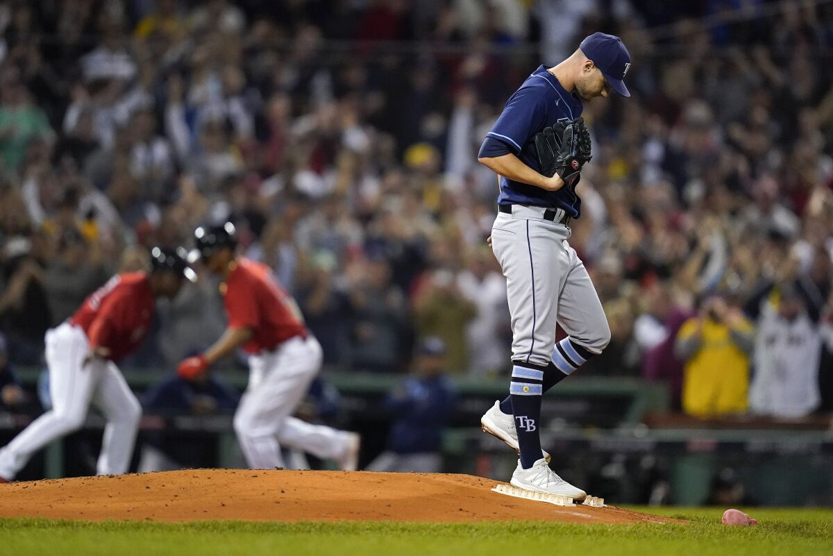 Tampa Bay Rays pitcher Shane McClanahan reacts after giving up a three-run home run during the third inning to the Boston Red Sox during Game 4 of a baseball American League Division Series, Monday, Oct. 11, 2021, in Boston. (AP Photo/Charles Krupa)