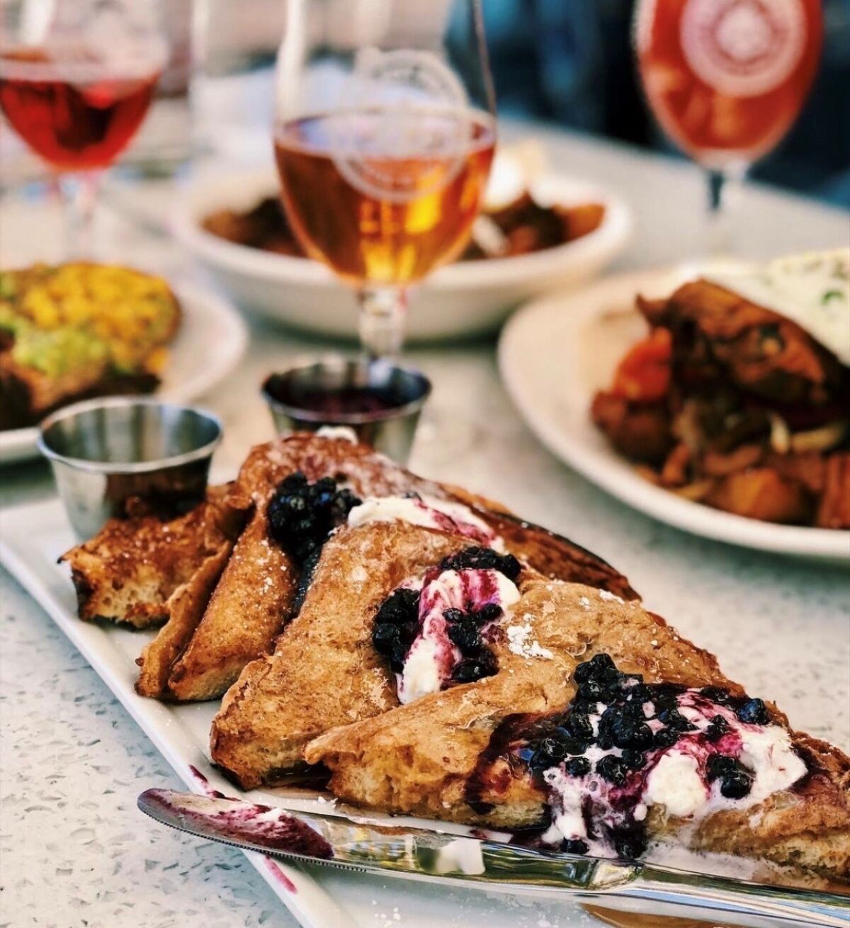 Ballast Point's Mother's Day brunch carry out, which includes brioche french toast and a crowler of beer.