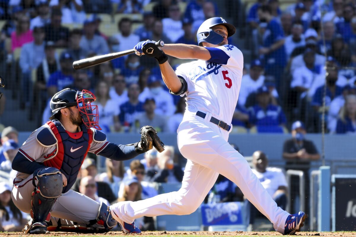 Corey Seager hits a two-run home run during the first inning in Game 3.