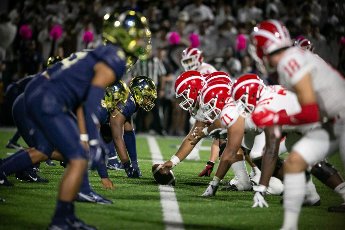St. John Bosco's defense prepares for the Mater Dei offense at the line of scrimmage.