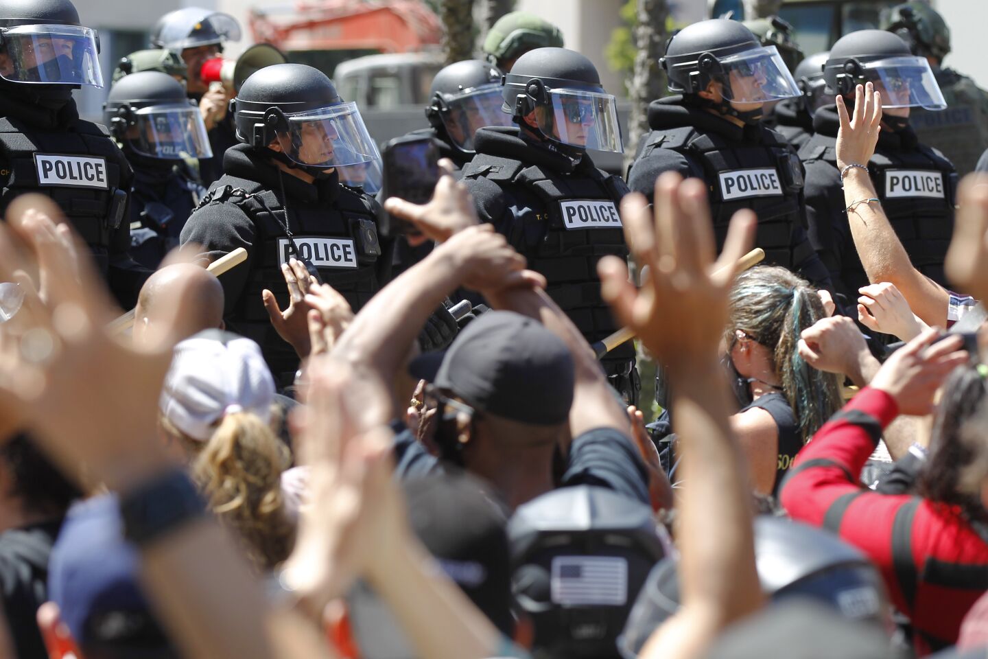 San Diego police in riot gear lined Broadway in downtown San Diego, stopping a group of protesters on May 31, 2020. The group was protesting the death of George Floyd.