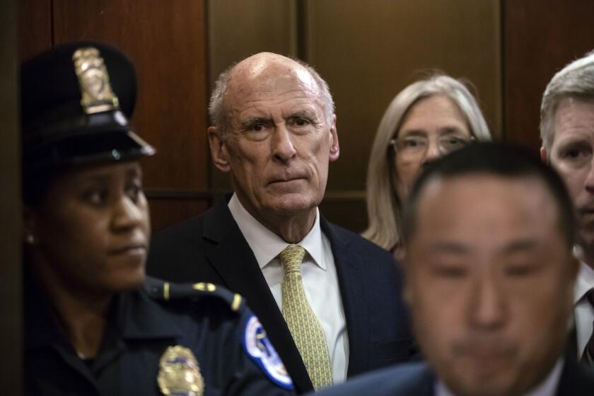 Director of National Intelligence Dan Coats arrives as House and Senate lawmakers from both parties gather for a classified briefing in a secure room about the federal investigation into President Donald Trump's 2016 campaign, on Capitol Hill in Washington, Thursday, May 24, 2018. (AP Photo/J. Scott Applewhite)