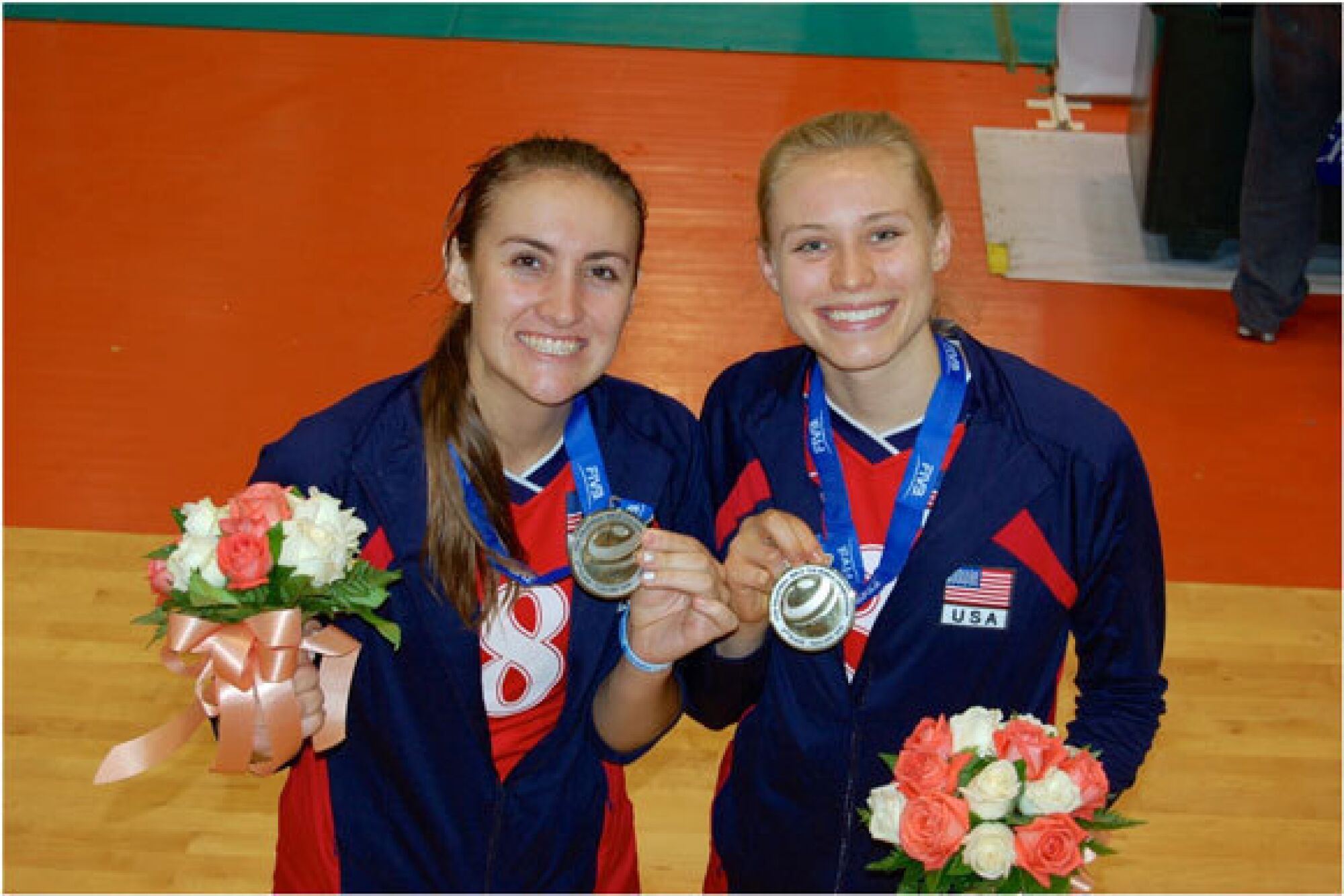 Hayley Hodson, right, and Tia Scambray show off the silver medals they won.