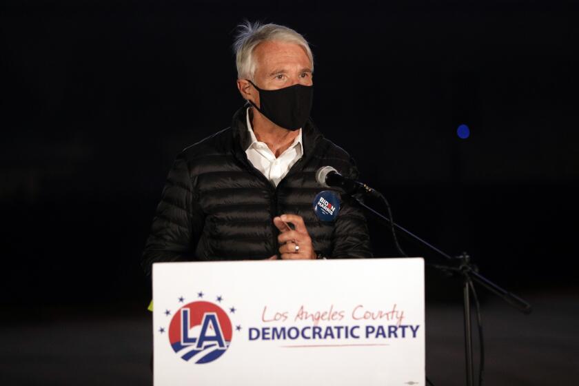 LOS ANGELES, CA - NOVEMBER 03: George Gascon, candidate for Los Angeles District Attorney, speaks during a drive-in election night watch party at the LA Zoo parking lot on Tuesday, Nov. 3, 2020. (Myung J. Chun / Los Angeles Times)