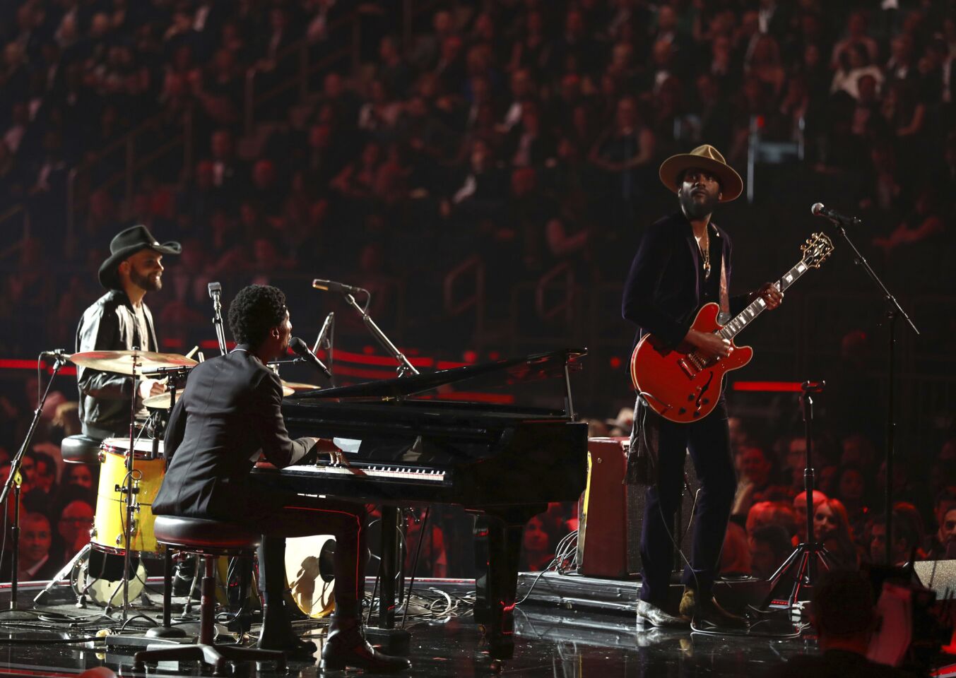 Joe Saylor, left, Jon Batiste and Gary Clark Jr. perform a tribute to Chuck Berry and Fats Domino.