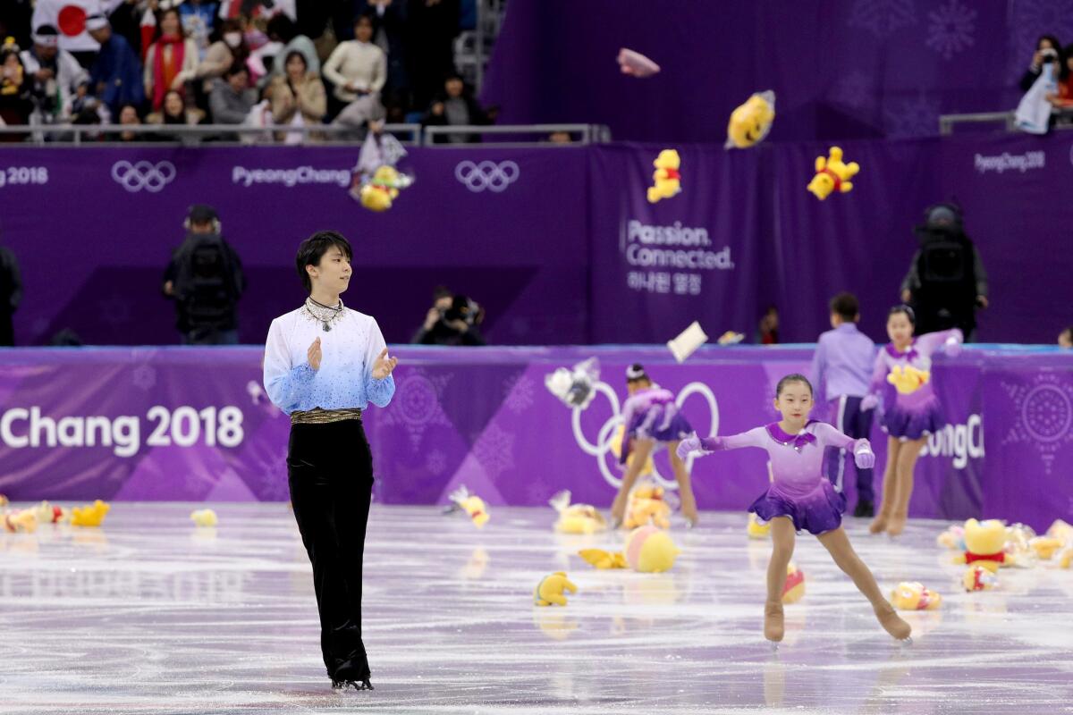Fans throw gifts on the ice for Yuzuru Hanyu of Japan after his routine during the men's short program at Gangneung Ice Arena on Feb. 16.