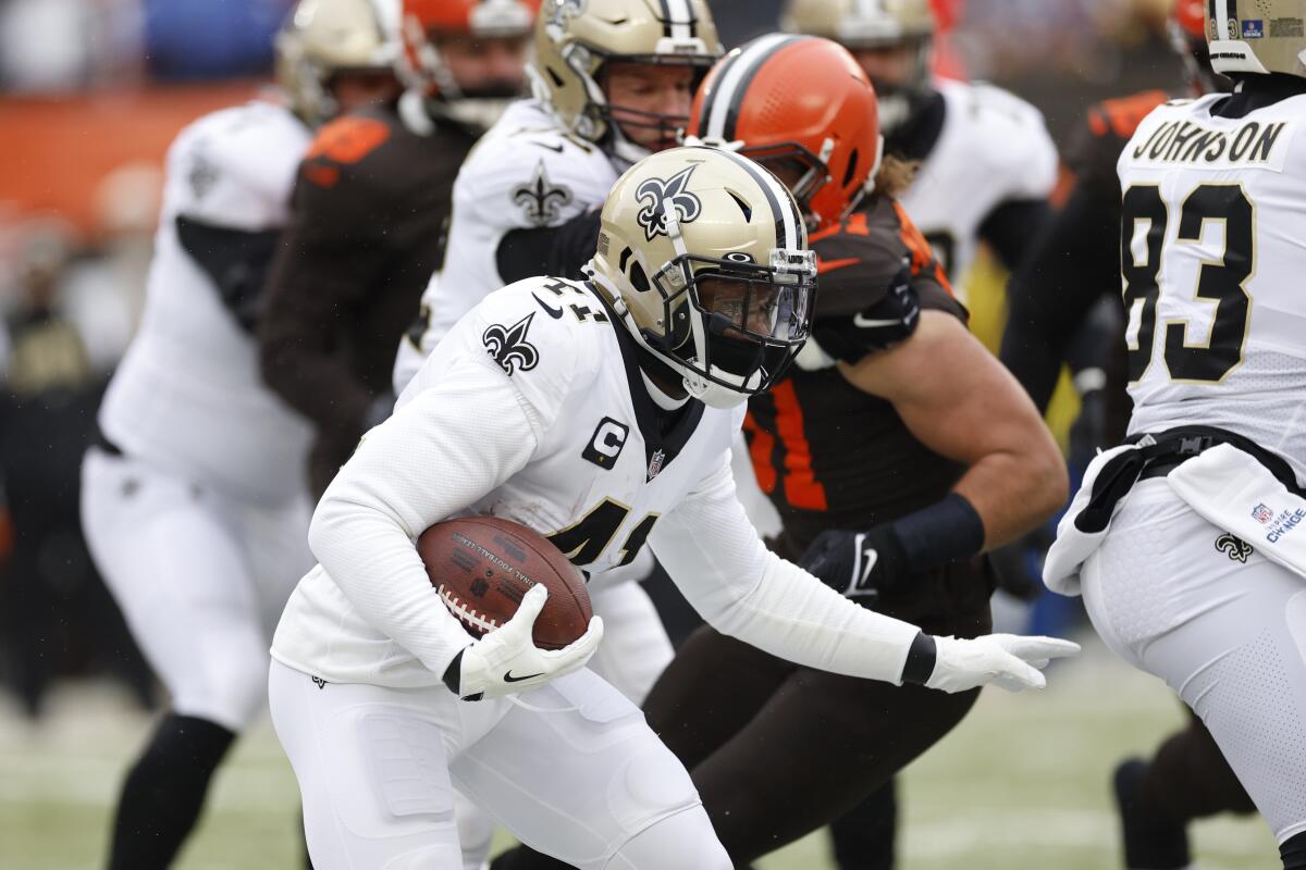 New Orleans Saints running back Alvin Kamara carries the ball against the Cleveland Browns.