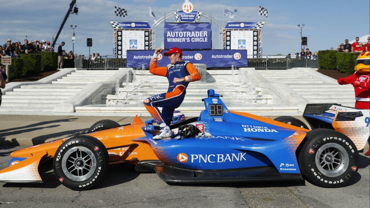 Scott Dixon celebrates after winning the second race of the IndyCar Detroit Grand Prix on June 2.