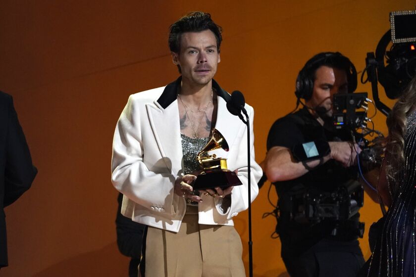 Harry Styles accepts the award for best pop vocal album for "Harry's House" at the 65th annual Grammy Awards on Sunday, Feb. 5, 2023, in Los Angeles. (AP Photo/Chris Pizzello)