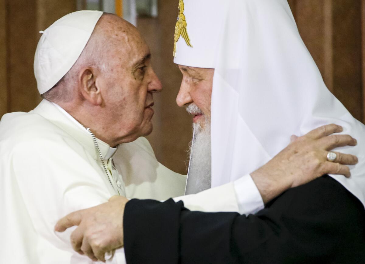FILE — In this Friday, Feb. 12, 2016 file photo, Pope Francis, left, reaches to embrace Russian Orthodox Patriarch Kirill after signing a joint declaration at the Jose Marti International airport in Havana, Cuba. The Vatican confirmed Monday that Pope Francis will travel next month to Kazakhstan, where he could meet with Patriarch Kirill, the leader of the Russian Orthodox Church who has justified Moscow’s war in Ukraine. (AP Photo/Gregorio Borgia, Pool)