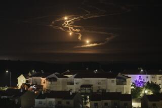 Flares rise over the Gaza Strip as seen from southern Israel, Monday, Jan. 8, 2024. (AP Photo/Leo Correa)