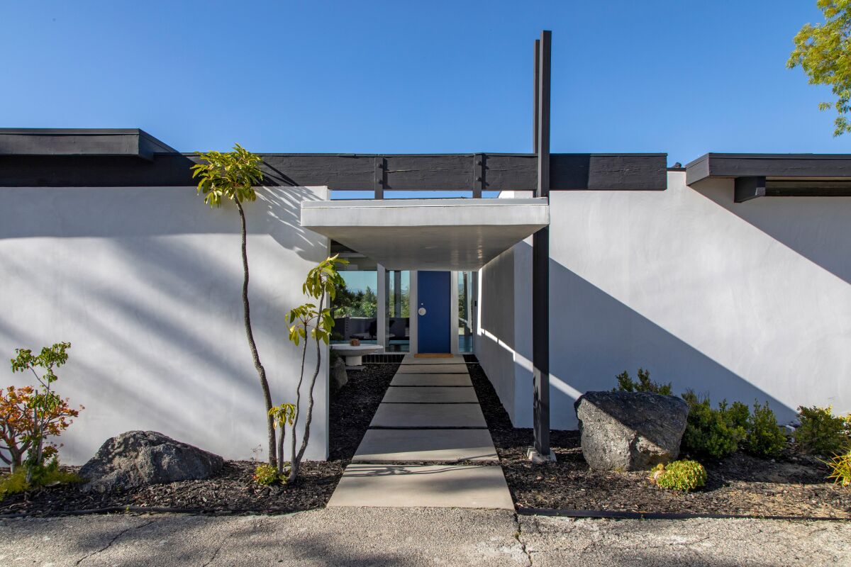 The covered walkway at the front entrance of a Richard Neutra-designed house.