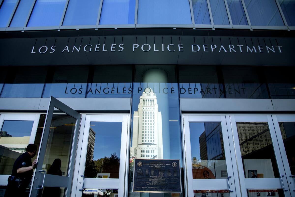 A police officer walks into the Los Angeles Police Department building