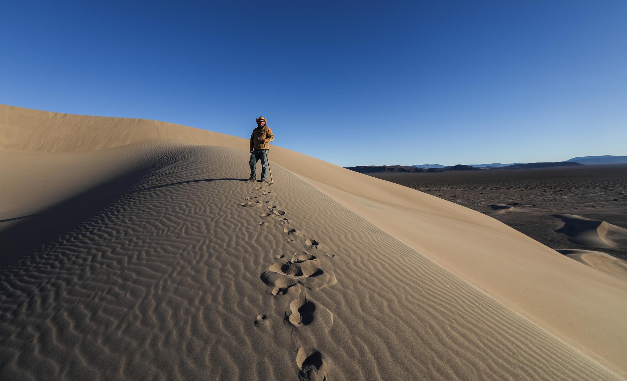 Patrick Donnelly hikes up Big Dune.