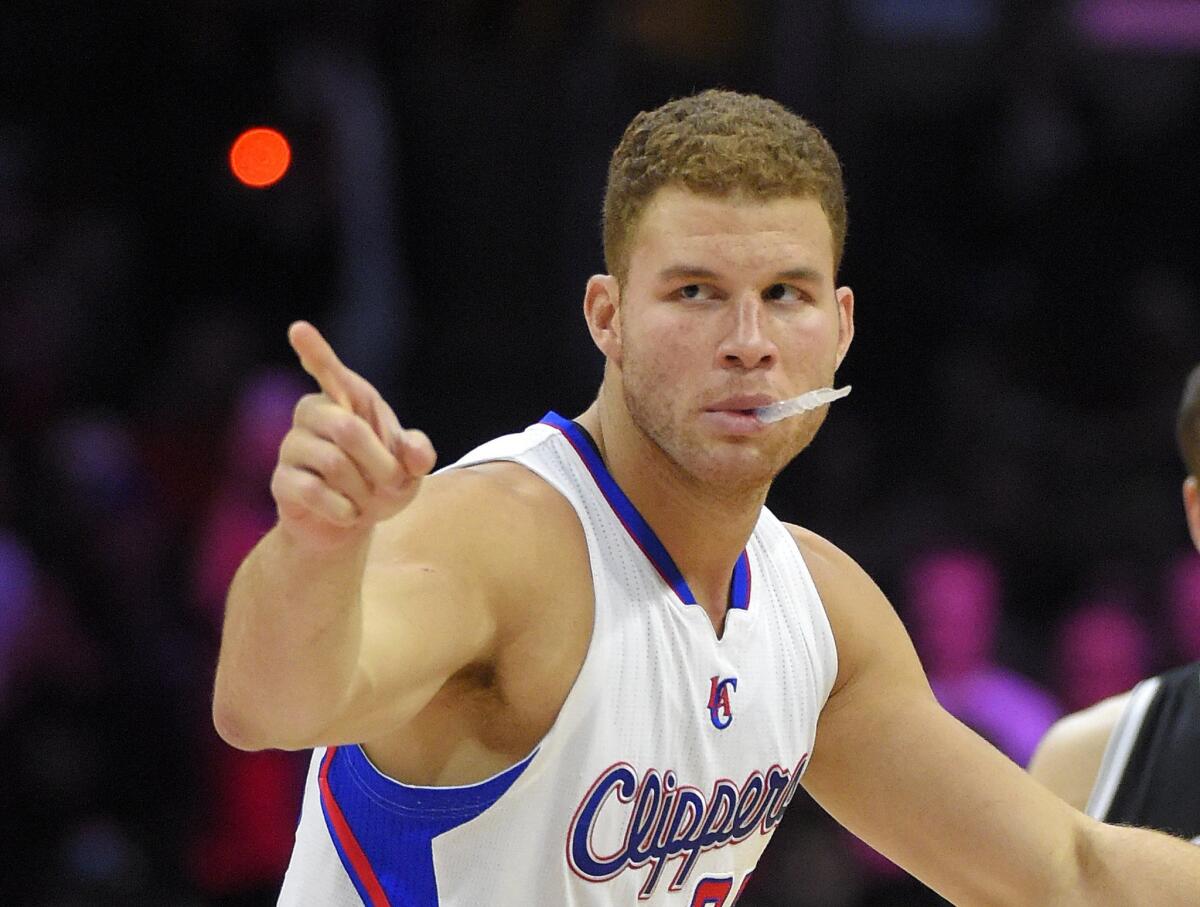 Clippers forward Blake Griffin points at members of the Brooklyn Nets before the start of a game Jan. 22 at Staples Center.