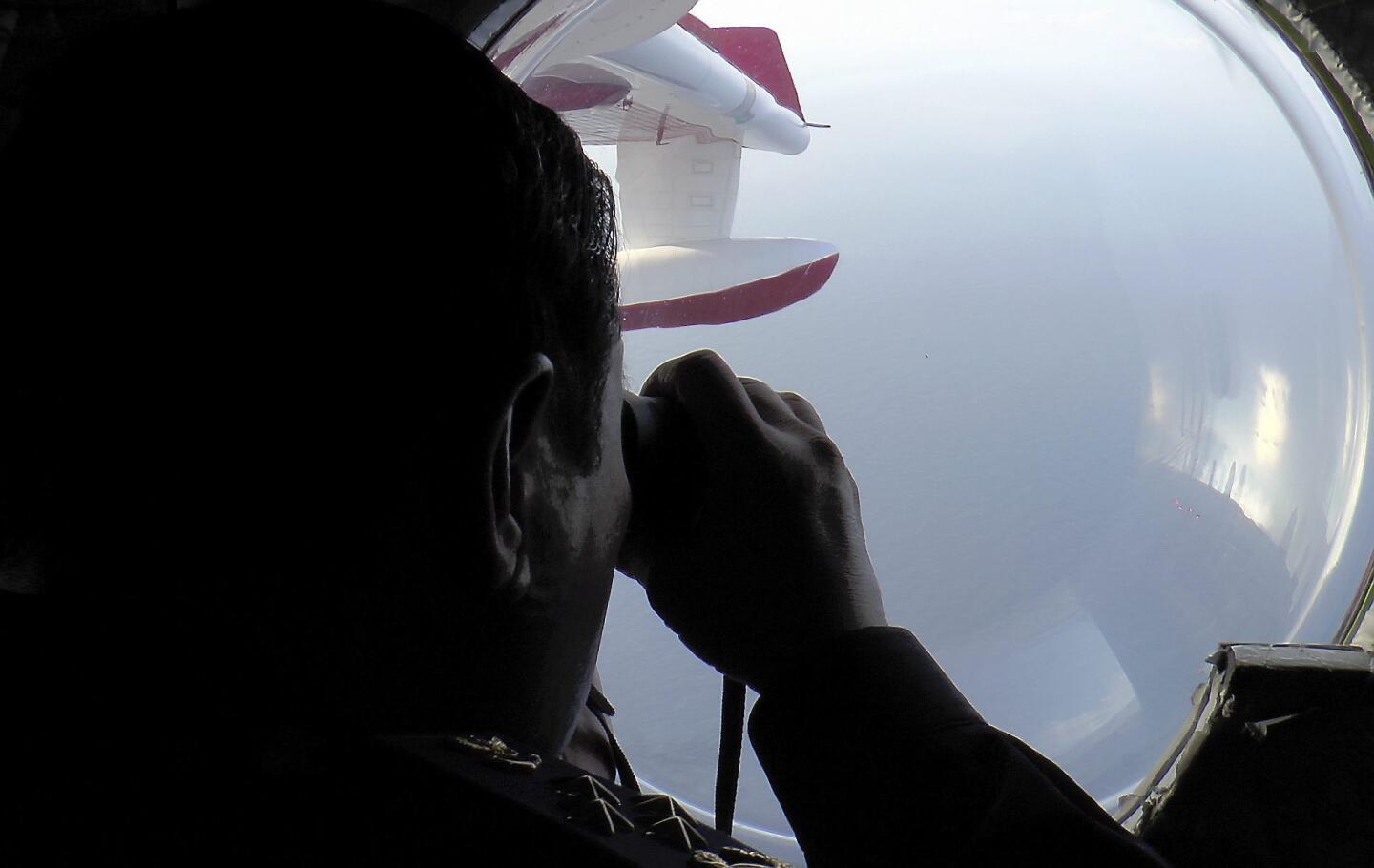A handout picture provided by Malaysian Maritime Agency shows search and rescue operations for a missing Malaysian Airlines flight off the coast of Malaysia.