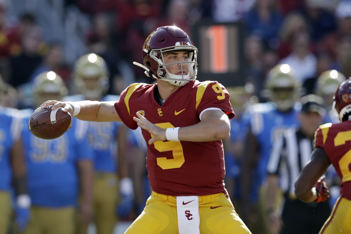 USC quarterback Kedon Slovis throws against UCLA during the first half on Nov. 23, 2019, at the Coliseum.