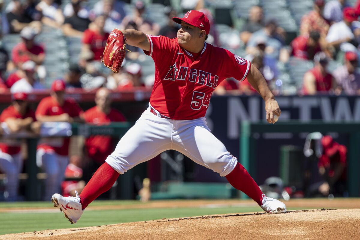 Angels pitcher  José Suarez throws to a Seattle Mariners batter.