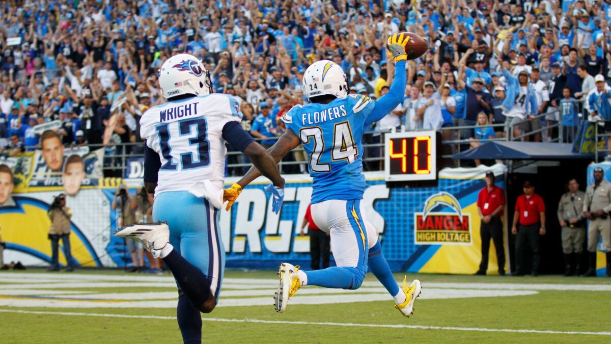 San Diego Chargers Brandon Flowers runs in an interception for a touchdown in the 4th quarter as Tennessee Titans Kendall Wright trails at Qualcomm Stadium on Nov. 6, 2016. Photo by K.C. Alfred/The San Diego Union-Tribune