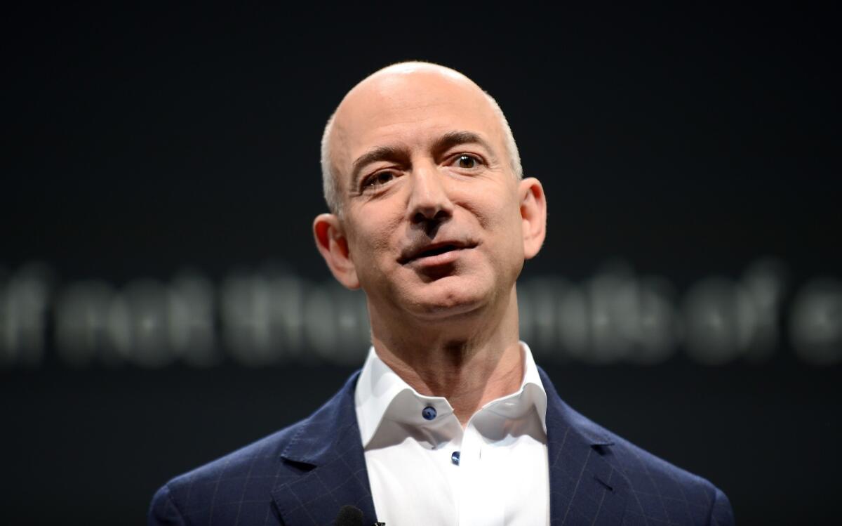 Amazon CEO Jeff Bezos, newly-announced owner of the Washington Post, photographed at a Kindle press conference in 2012.