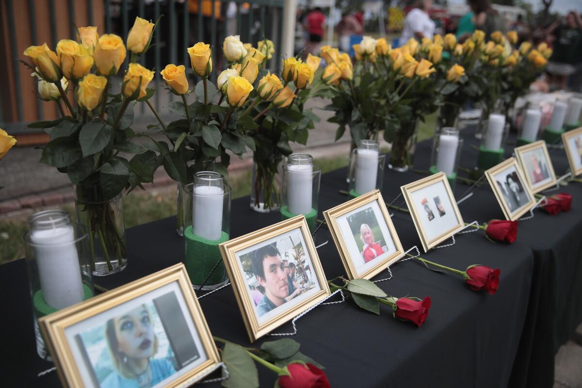 Pictures of victims of Santa Fe High School shooting displayed at a prayer vigil. 