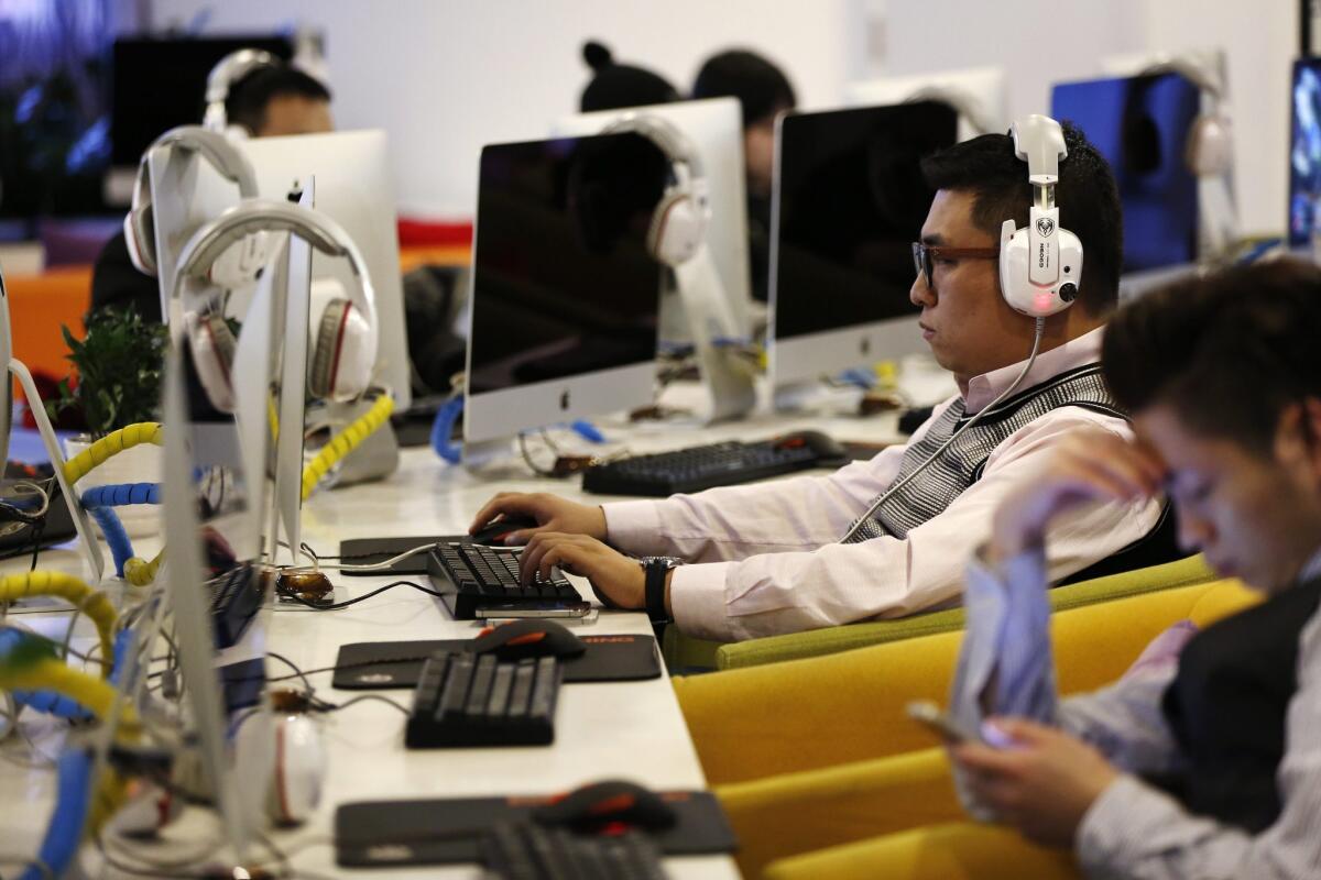 People use computers in an internet cafe in Beijing on Jan. 27. Chinese internet officials have defended the country's recent efforts to block virtual private networks (VPNs), which are used to get around the country's strict internet controls.