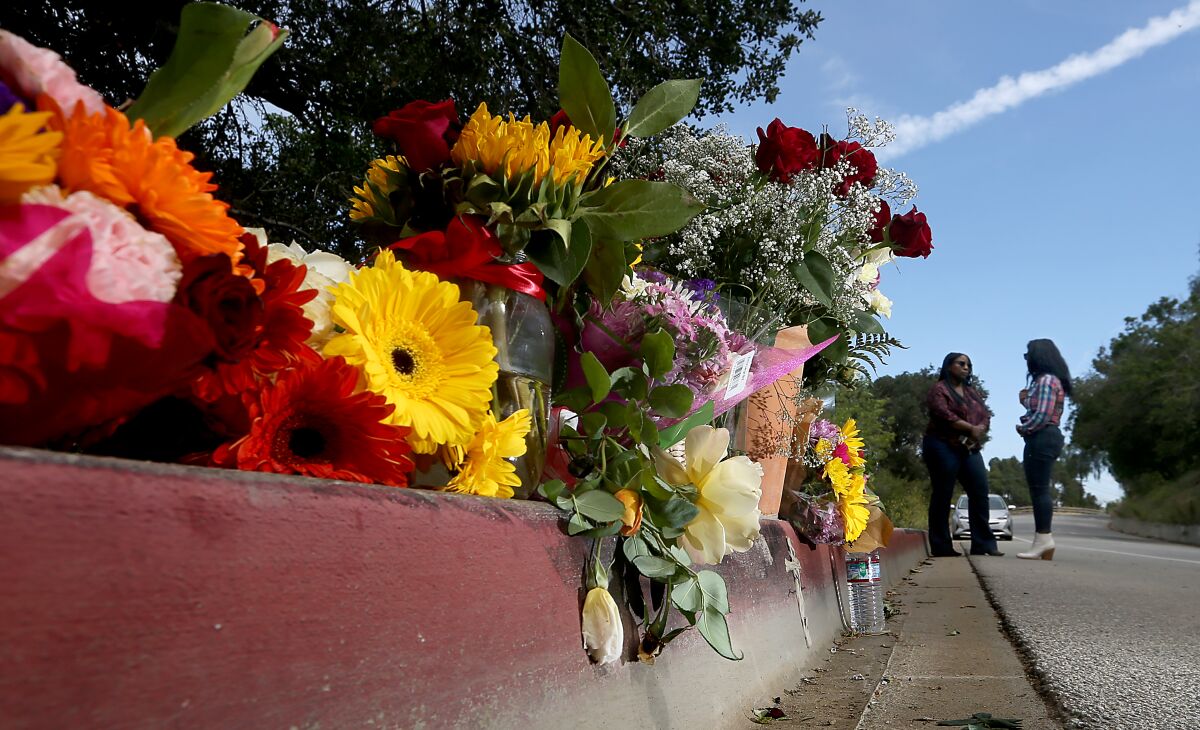 Flowers mark the location where bicyclist Andrew Jelmert was killed.