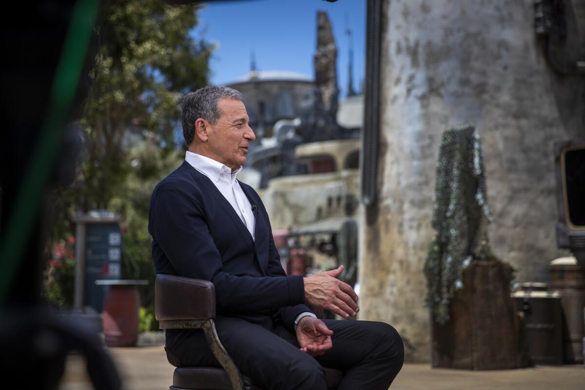 Bob Iger, in a dark suit, speaks at a media event.