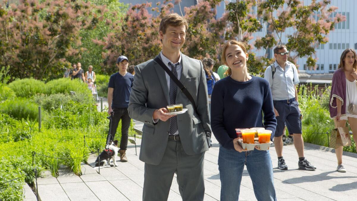 Glen Powell and Zoey Deutch in a scene from "Set It Up."