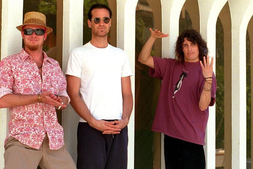 Three of the 4 members of the San Diego–based Stone Temple Pilots hanging out near the offices of their publisists. Scott Weiland, left, Robert Deleo, and Dean Deleo. Missing is drummer Eric Kretz.
