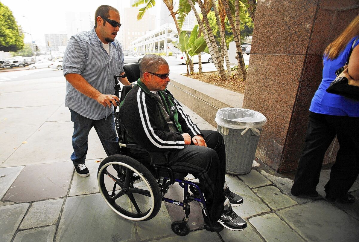 Bryan Stow heads to the courthouse in Los Angeles. Doctors say the former paramedic can process information only at a superficial level after being beaten at a Dodgers game.