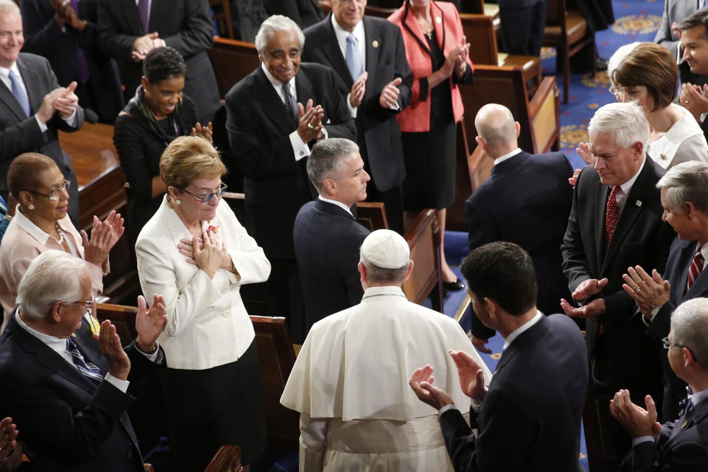 Pope Francis is applauded as he arrives on Capitol Hill on Sept. 24, 2015, to address a joint meeting of Congress, making history as the first pontiff to do so.