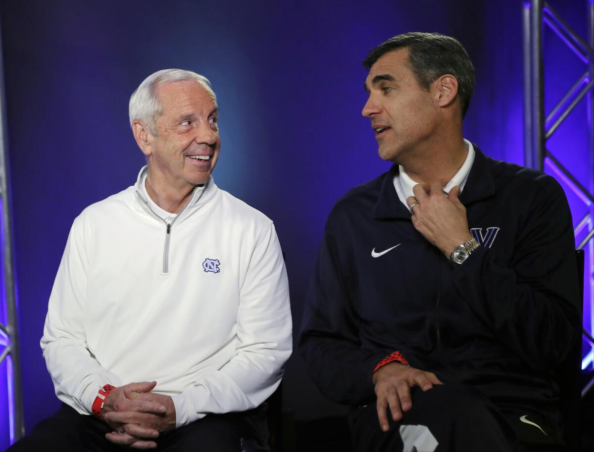 North Carolina Coach Roy Williams and Villanova Coach Jay Wright talk during a CBS Sports Network interview.