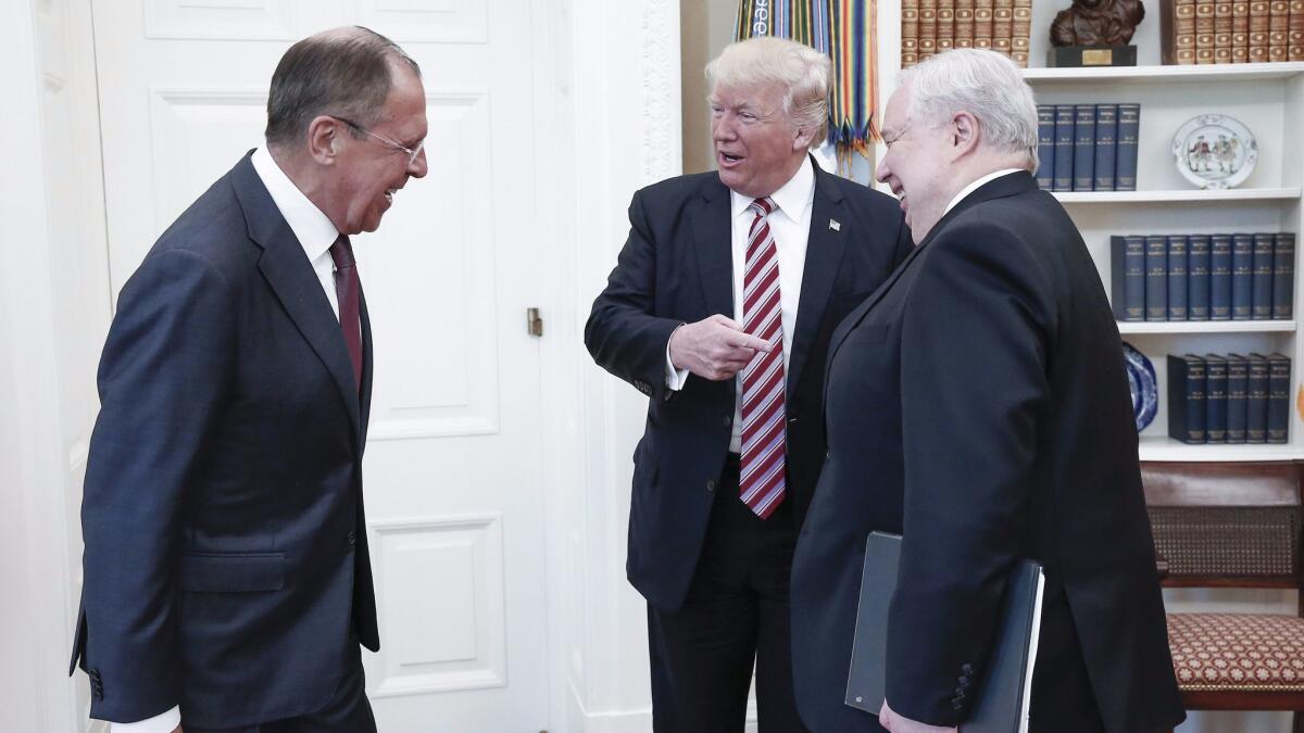From left, Russian Foreign Minister Sergei Lavrov, President Trump and Russian Ambassador Sergey Kislyak in the Oval Office on May 10. (Shcherbak Alexander / Tass)