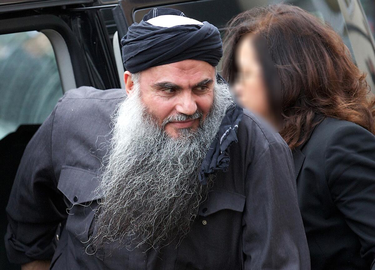 In a file picture taken Nov. 13, Jordanian terrorism suspect Abu Qatada arrives at his home in London after he was released from prison. The British government Wednesday lost an appeal against a court decision to block his deportation to Jordan.