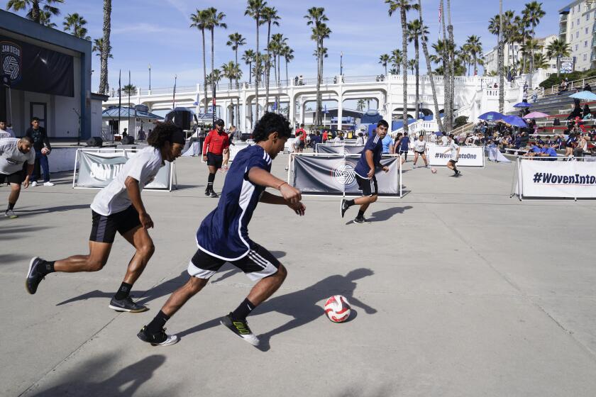 Oceanside, CA - January 27: San Diego FC kicked off its Chrome Ball Tour at the Junior Seau Pier Amphitheater on Saturday, January 27, 2024, in Oceanside, CA. Chula Vista Pickup (blue jersey) took on Bridge Barkada (white jersey) in the first round of games. The tournament is made up of 10 teams, in each division of men, women, girls, and boys. (Nelvin C. Cepeda / The San Diego Union-Tribune)