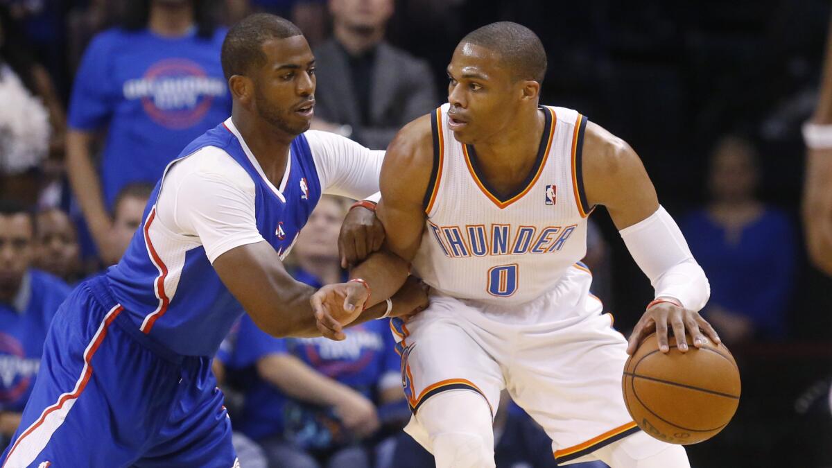 Clippers point guard Chris Paul, left, defends against Oklahoma City Thunder point guard Russell Westbrook during Game 1 of the Western Conference semifinals in May.