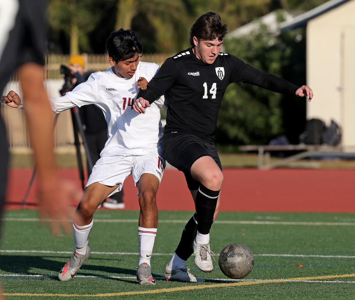 Marina's Tomaslav Steele, right, battles against Ocean View's Miguel Guzman, left, in a nonleague match on Friday.