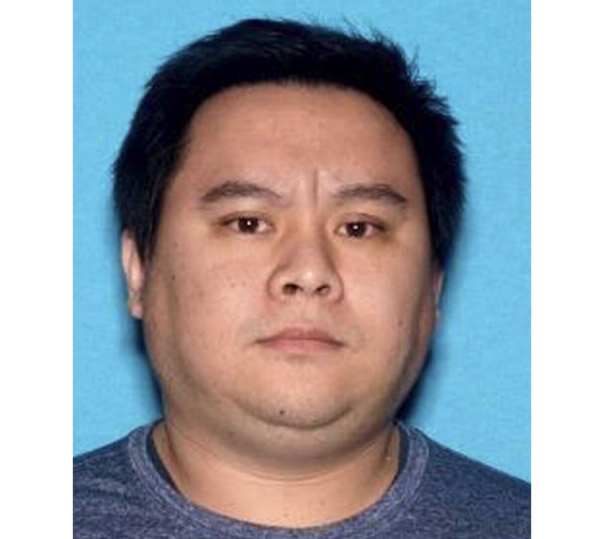 A mug shot of arrested high school teacher Siu Kong Sit, 37.